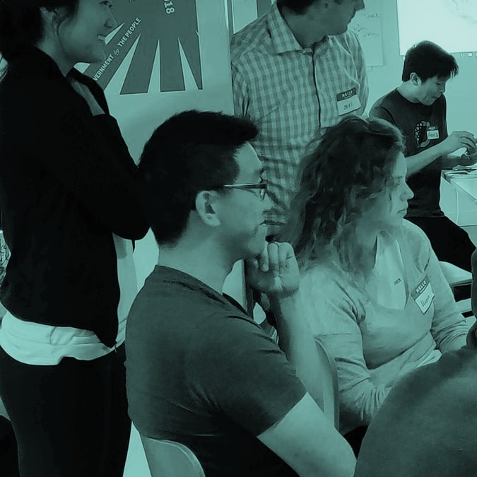 Open oakland members working together at a computer